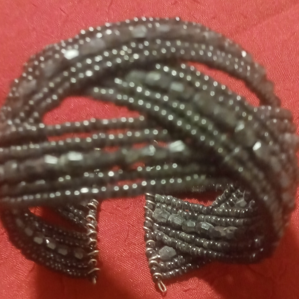 Black beaded wire wrapped cuff bracelet. Braided